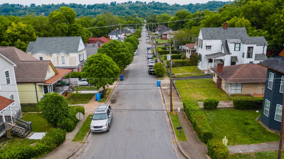 Quiet tree-lined residential street typical of central Austin