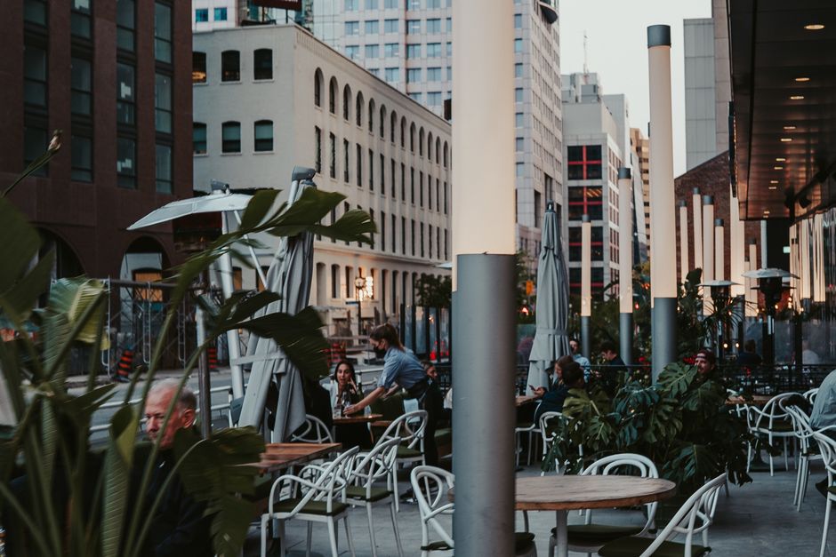 Austin-style outdoor cafe street scene near the brokerage's service area