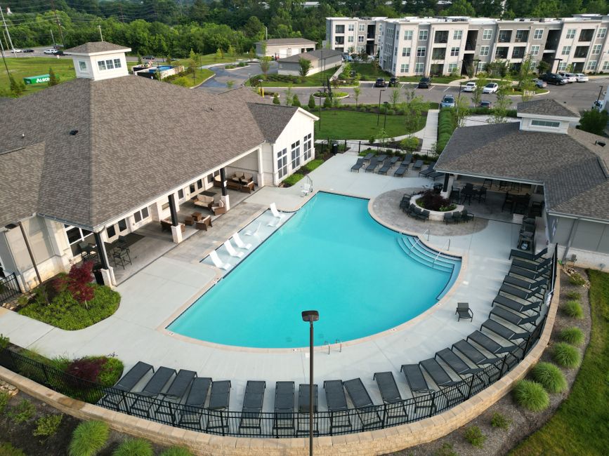 Apartment community pool and lounge amenity area