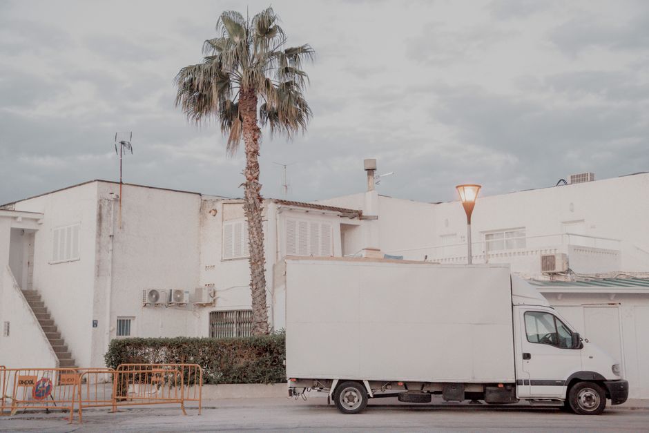 Moving truck parked outside a home during a relocation