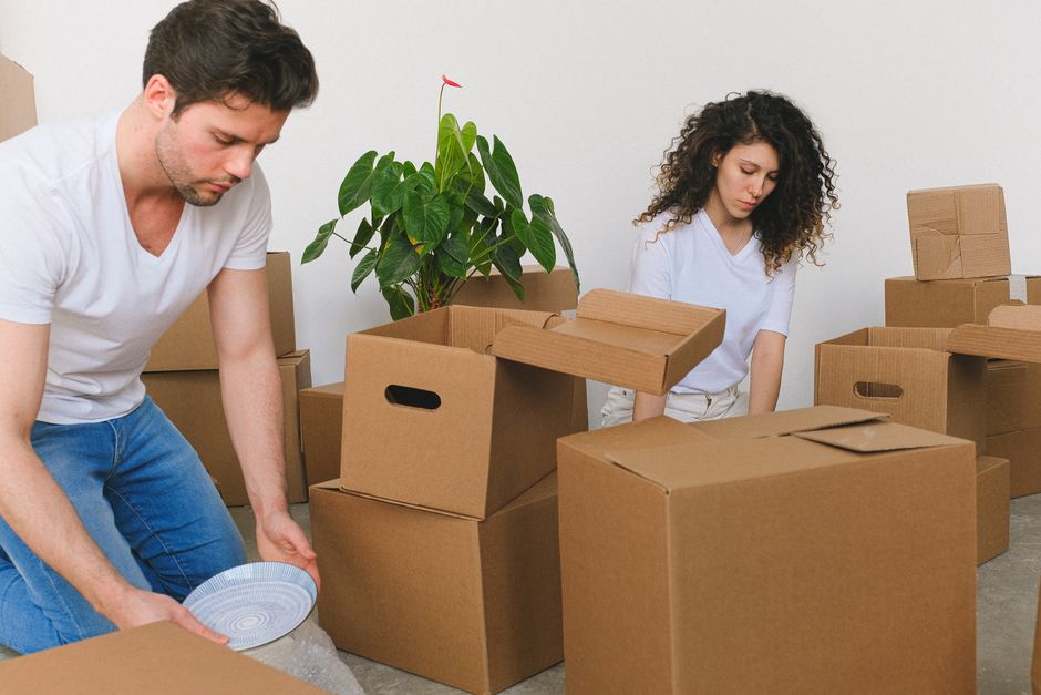 Moving boxes packed and ready by the front door